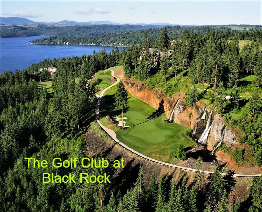 Golf course with waterfalls and lake view.