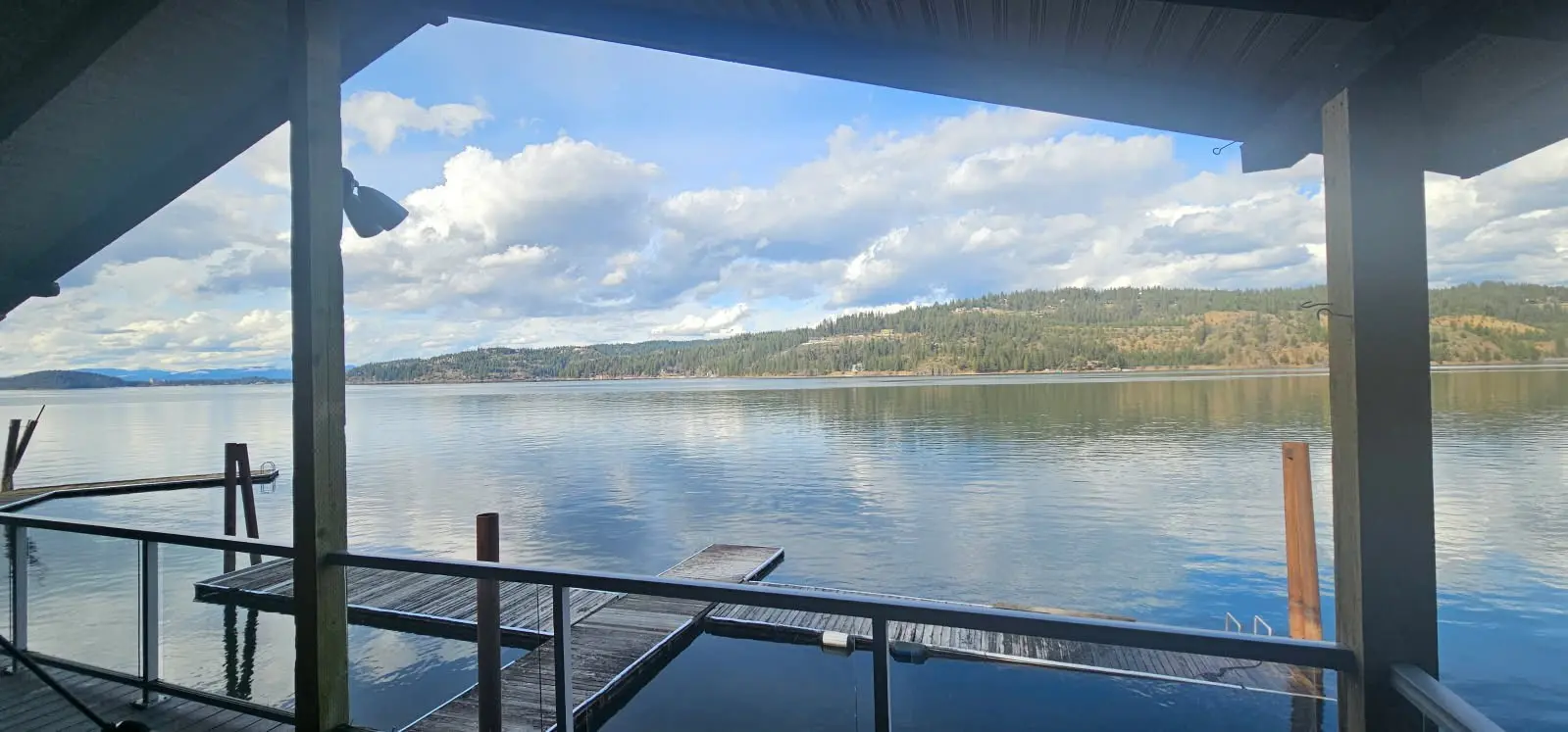 Lake view from covered deck with docks.