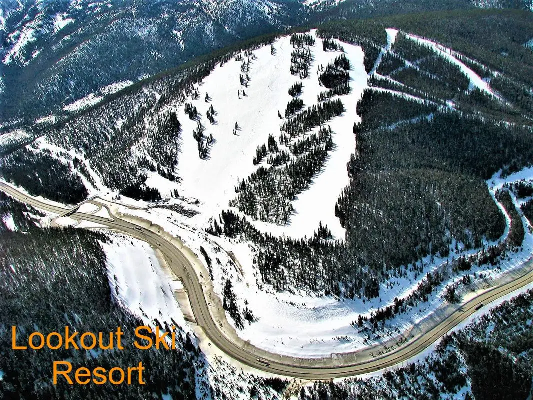 Aerial view of snowy ski resort slopes.