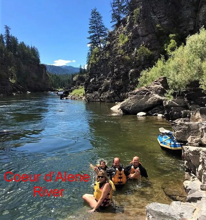 People swimming in Coeur d'Alene River.