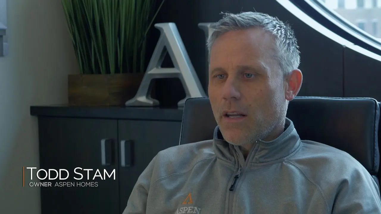 Man sitting in office, talking about business.