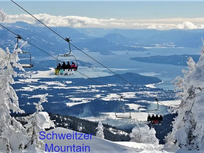 Ski lift over snowy Schweitzer Mountain landscape.