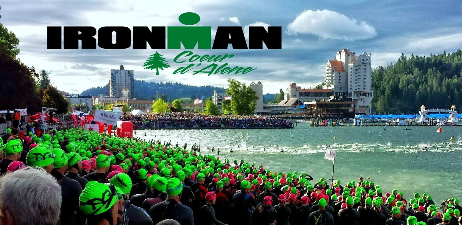 Ironman triathletes in green swim caps